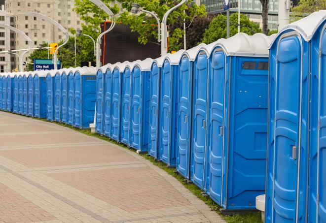 a line of portable restrooms set up for a wedding or special event, ensuring guests have access to comfortable and clean facilities throughout the duration of the celebration in Columbia Heights